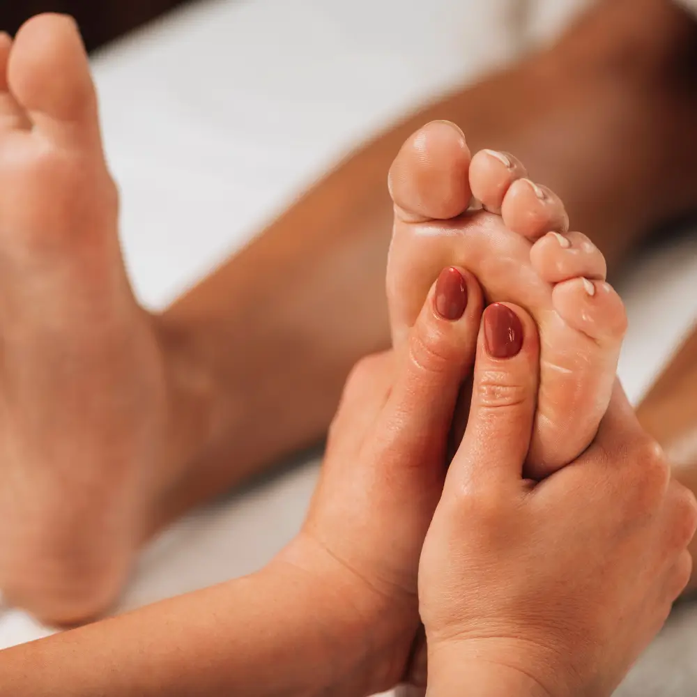 Reflexology on foot arches stimulating internal organs