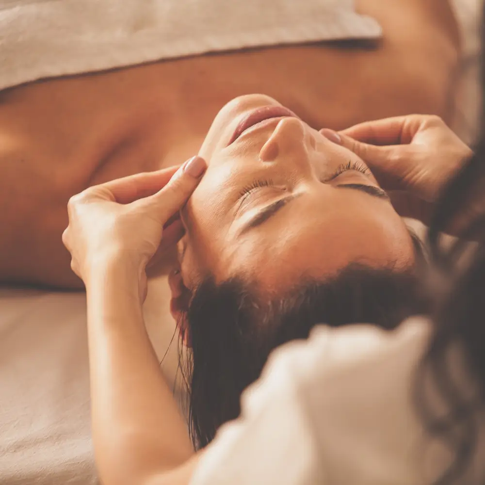 Calm moment during facial therapy, closing the eyes and relaxing