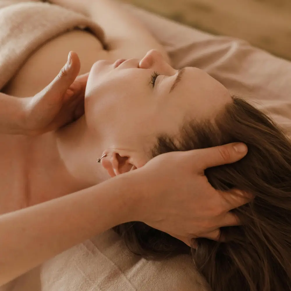 Calming reflexology treatment with closed eyes and relaxed breathing